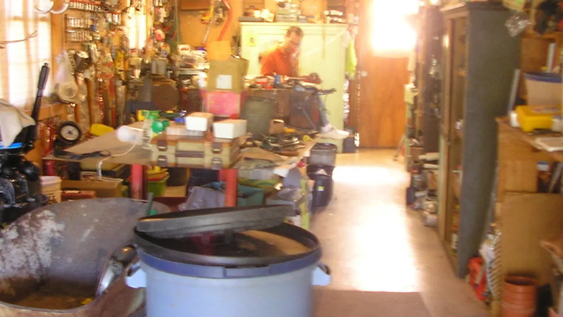 Compact workshop space with tools and work surfaces
