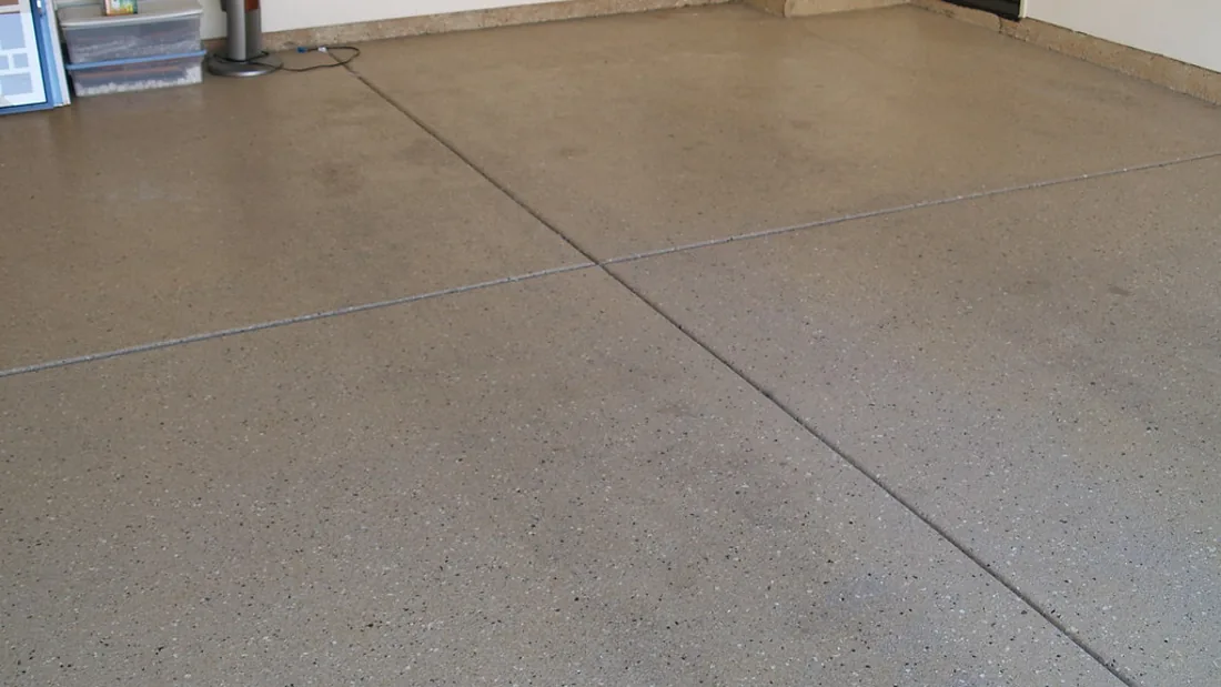 Clean garage floor surface for rolling stool safety